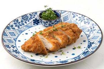 Crispy Fried Chicken Breast Slices Served on Elegant Plate
