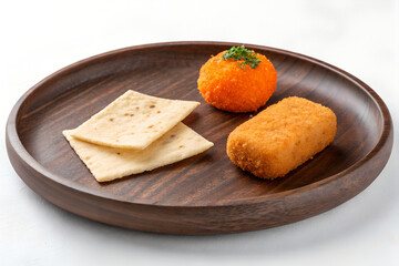 Delicious Indian Snacks on Wooden Plate &ndash; Cutlet, Cheese Ball & Flatbread
