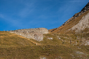autumnal mountain landscape inside the Stelvio National Park along the Lombard side, Sondrio, Italy