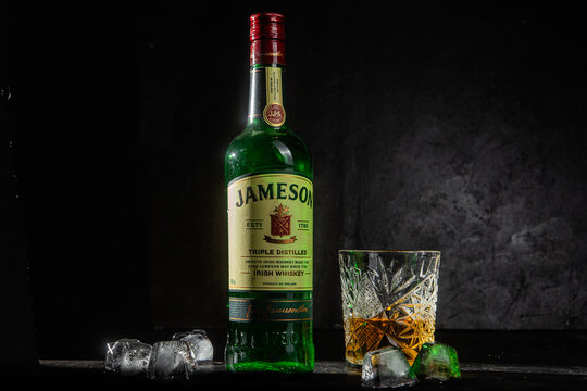  Bottle of whiskey Jameson on a dark background	