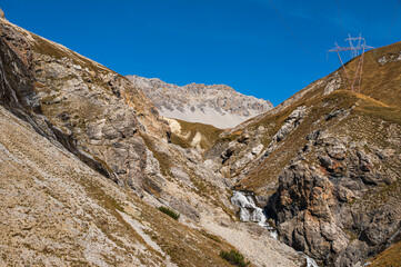 autumnal mountain landscape inside the Stelvio National Park along the Lombard side, Sondrio, Italy