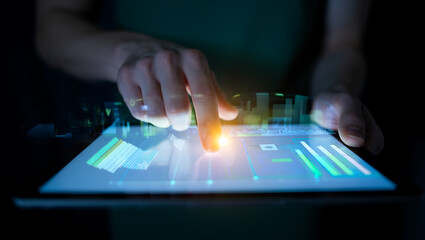 Person interacting with digital interface displaying financial data technology