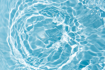 Blue water with ripples on the surface. Defocus blurred transparent blue colored clear calm water...