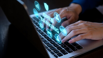 Person typing on laptop with glowing digital banking icons hands