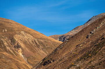 autumnal mountain landscape inside the Stelvio National Park along the Lombard side, Sondrio, Italy
