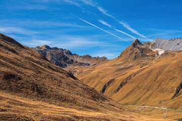 autumnal mountain landscape inside the Stelvio National Park along the Lombard side, Sondrio, Italy