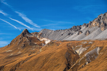 autumnal mountain landscape inside the Stelvio National Park along the Lombard side, Sondrio, Italy