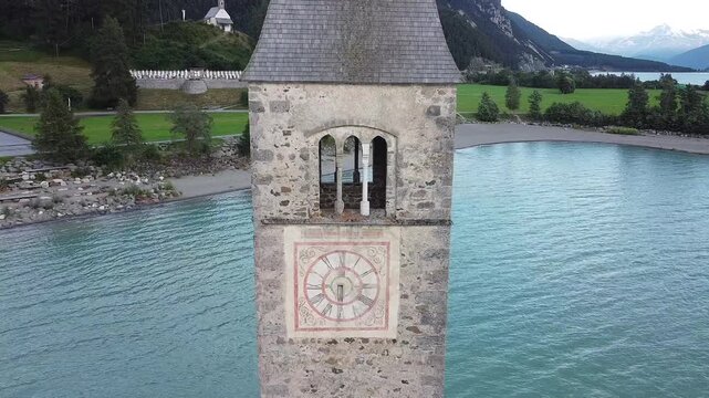 The iconic submerged Church Tower of Graun, Lake Reschensee, Italy 