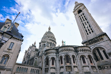 Wide angle view of the rear facade of Sacre Coeur basilica in Paris, France, with stone...