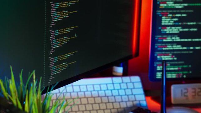 Code monitor home office color lighting setup featuring modern workspace with keyboard