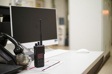 Dispatcher Communication Center Workspace: Radio, Telephone, Computer for Emergency Response Management. Modern Equipment on Desktop, White Environment, Workplace Technology Communication Solution