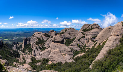 Panorama view of round rocky mountains of Sant Jeroni in Montserrat near Barcelona on a sunny spring day, Catalonia, Spain