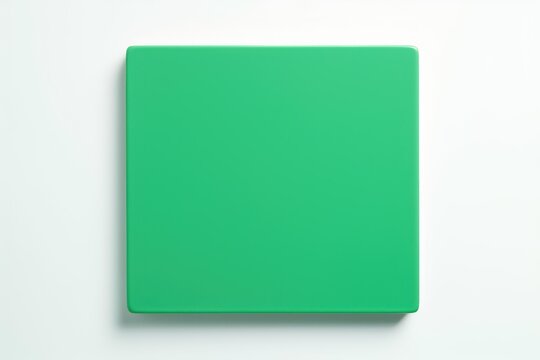 Clean green cutting board on a white background, ready for chopping vegetables and preparing meals