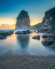 Ingelijste posters Ziekenhuis The breathtaking sunset on the rocky beach offers a unique experience, with dramatic scenery and soothing sounds  © Matheus