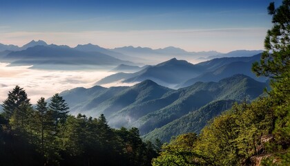 Fototapeta premium misty mountain vista a tranquil panorama unfolds as rolling mountain ranges recede into the distance shrouded in a mystical veil of ethereal mist