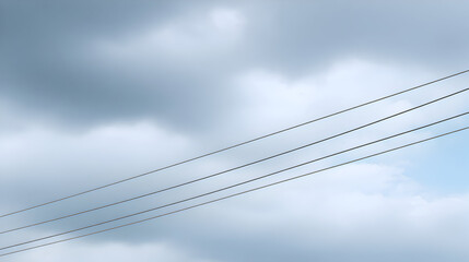 Overcast sky with gray clouds and power lines stretching across the horizon, creating a moody atmosphere and a sense of depth in the landscape