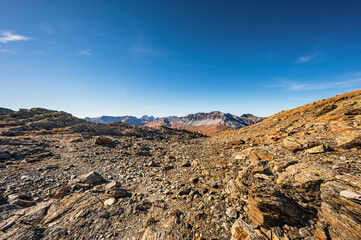 autumnal mountain landscape inside the Stelvio National Park along the Lombard side, Sondrio, Italy