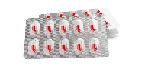 Three pill blister packs with red and white pill capsules stacked and one leaning in front on white background, medication, pharmacy or drug concept