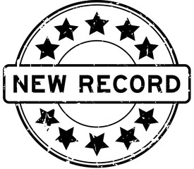 Grunge black new record word round rubber seal stamp on white background