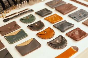 Leather purses on flea market in Lisbon. Garage sale, reuse the clothes, second hand and eco consumer