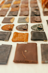 Leather purses on flea market in Lisbon. Garage sale, reuse the clothes, second hand and eco consumer
