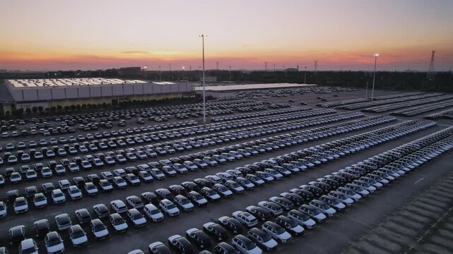 The newly produced cars from the automobile factory are parked in the parking lot