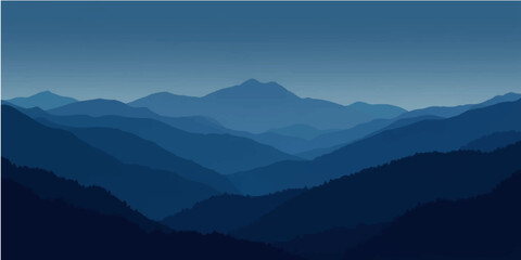 Fototapeta premium Misty mountain peaks at sunrise with a dramatic cloud-filled sky