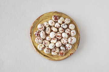 Close-up of a puffed lotus seed, makhana, an exotic vegetable ingredient