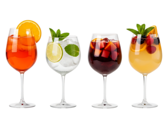 Four colorful cocktails with fruit and mint garnishes isolated on a transparent background drinks