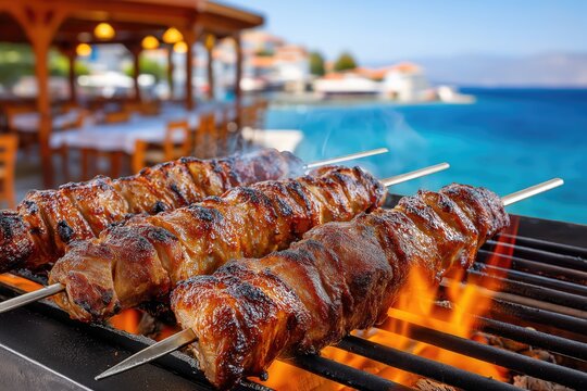 Delicious kontosouvli grilling over flames at seaside restaurant