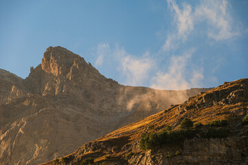 sunset over an autumnal mountain landscape inside the Stelvio National Park along the Lombard side, Sondrio, Italy