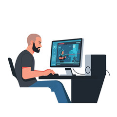 A man with a beard is playing a video game on a desktop computer, sitting at a desk.
