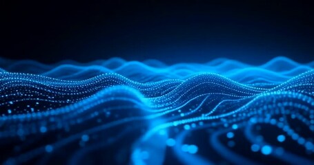 Abstract blue waves of glowing particles in a dark environment.