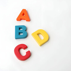 Multiple colorful letters in various sizes and fonts, scattered playfully.