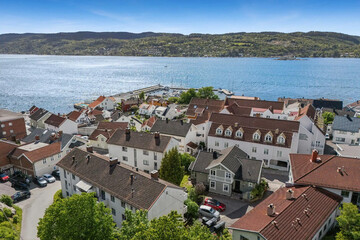 beautiful areal view of typical norwegian village from above with luxury villas sea fishermen's houses and boats. 
fishing village
