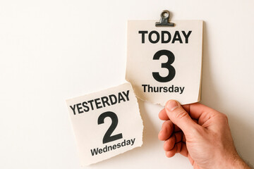 The calendar holds the present day, not letting go of yesterday. Space for text.