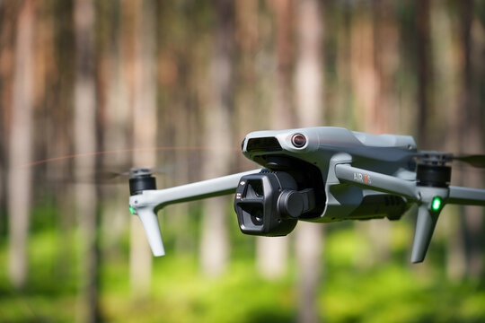 Kotka, Finland - JULY 26, 2025: DJI Air 3S drone in the forest, close-up side view.