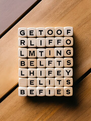 Wooden blocks with words 'Get Rid Of Limiting Beliefs'.