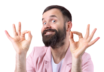Portrait of a smiling young man in a pink jacket. Man showing ok gesture while standing in studio over isolated red background.