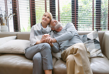 Happy romantic couple in love embracing and hold hands and grey haired husband and wife, middle aged smiling family enjoying tender moment. Retirement Senior Couple Lifestyle Living Concept