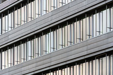 Obraz premium Grey modern facade with sleek vertical aluminum louvered panels