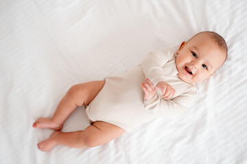 baby's legs, mother's hands holding baby's little legs, mother's love and care