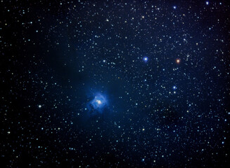 A colorful blue nebula in deep space