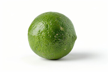 A fresh, whole green lime isolated on a white background, showcasing its vibrant color and textured skin.