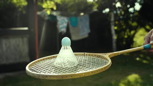 Shuttlecock and rackets for playing Badminton outdoors.