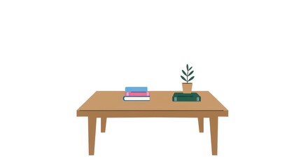 Simple wooden table with books and plant, a peaceful and organized workspace.