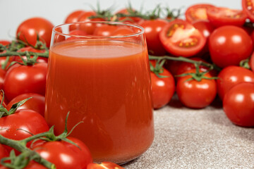 Freshly Squeezed Tomato Juice and Ripe Tomatoes.