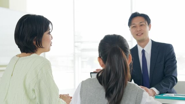 Parent and child having a three-way interview
