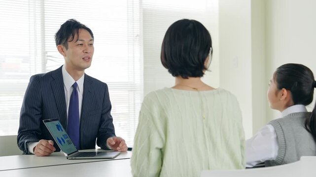 Parent and child having a three-way interview