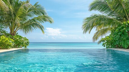 Pool leads to the ocean with palm trees around